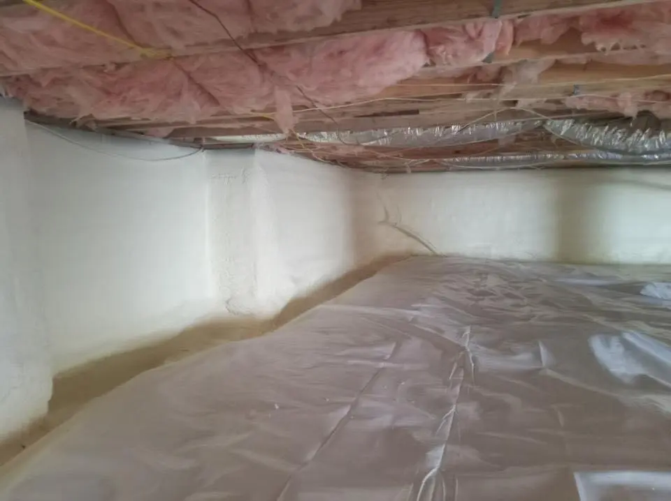Crawl space encapsulation with closed-cell spray foam for Commercial Roof Restoration in North Liberty